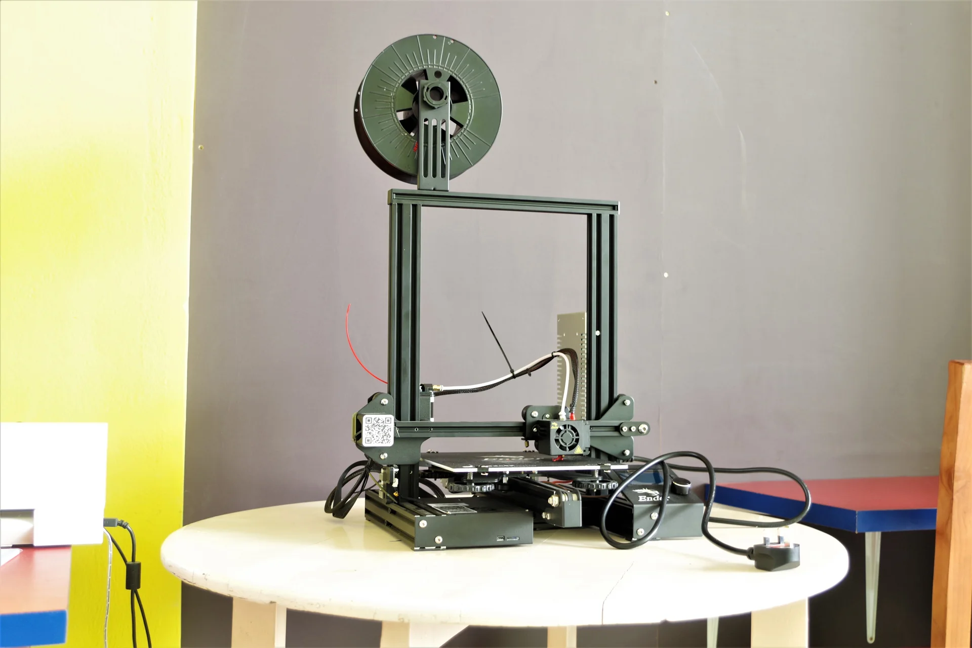A desktop 3D printer turning a digital design into a physical object